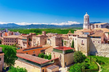 Top aerial view on Girona, Catalonia, Spain. Scenic and colorful ancient town. Famous tourist resort destination, perfect place for holiday and vacation. clipart