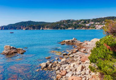 Promenade seafront in Calella de Palafrugell, Catalonia, Spain near Barcelona. Scenic village resort with nice sand beach and clear blue water in nice bay. Famous tourist destination in Costa Brava clipart