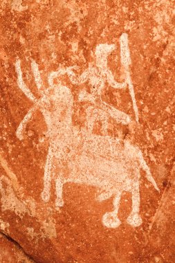 Bhimbetka 'nın tarihi yerindeki resimlerden biri. Buradaki kaya sığınakları ve mağaralarda çok sayıda resim var. En eski tabloların 10.000 yıllık olduğu ortaya çıktı..