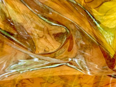 Tahta desenli sarı ve kahverengi bir yüzey bulanık bir görüntü. Görüntü rüya gibi, ruhani bir kaliteye sahip, sanki bir resim ya da fotoğrafmış gibi. Renkler sıcak ve davetkar.