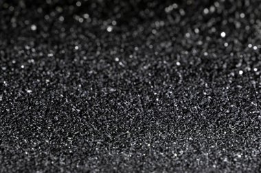 Hindistan cevizi kömürü dokusu bulanık arkaplan ve bokeh elementlerle. Metin için yer