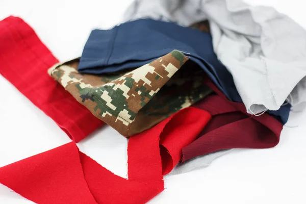 closeup of different colored clothes on pile