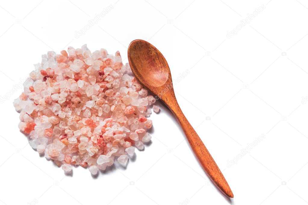 Pink salt from Bolivian and spoon isolated on white background