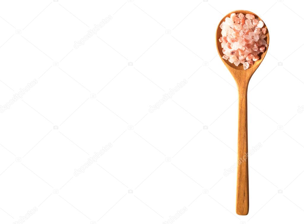 Spoon of Pink salt from Bolivian isolated on white background