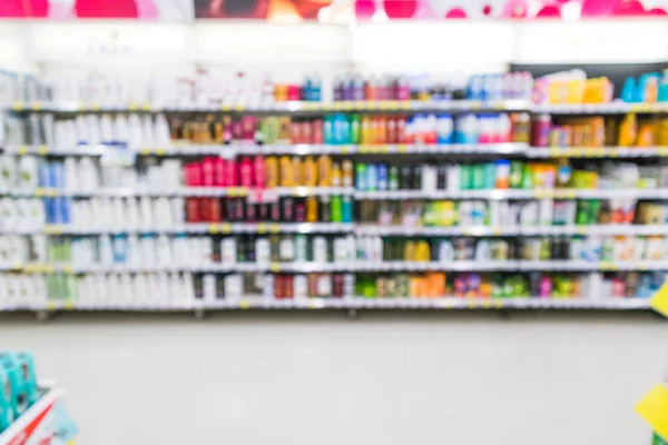 Blur supermarket aisle with shampoo product on the shelf background