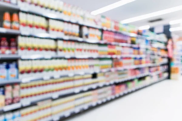 Blur Supermercado venta de jugo o sección de calabaza en los estantes de fondo — Foto de Stock