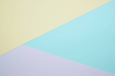 Moda pastel kağıt düz renkli yatıyordu üstten görünüm, geometrik arka plan dokusu, pembe, mor, sarı, bej, yeşil ve mavi renk.