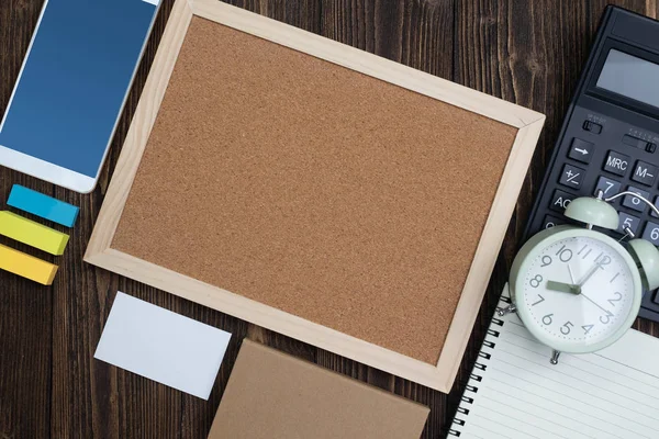 Office supplies or office work essential tools or items on wooden desk in workplace, top view with copy space for add text and message.