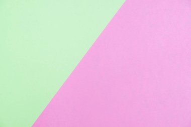 Kağıt düz renkli pastel yatıyordu üstten görünüm, arka plan dokusu, yeşil ve pembe renk.