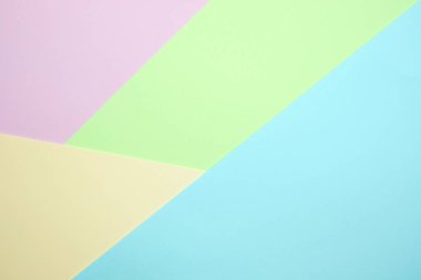 Moda pastel kağıt düz renkli yatıyordu üstten görünüm, geometrik arka plan dokusu, pembe, mor, sarı, bej, yeşil ve mavi renk.