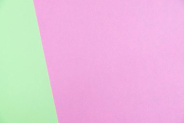 Kağıt düz renkli pastel yatıyordu üstten görünüm, arka plan dokusu, yeşil ve pembe renk.