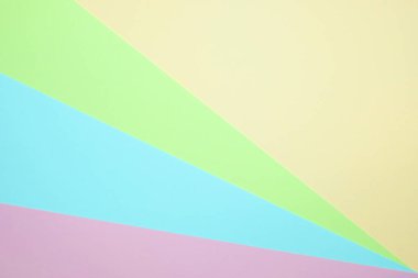 Moda pastel kağıt düz renkli yatıyordu üstten görünüm, geometrik arka plan dokusu, pembe, mor, sarı, bej, yeşil ve mavi renk.