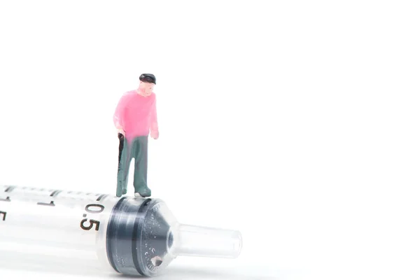 Miniature People Small Figure Old Man Patient Big Syringe Isolated — Stock Photo, Image