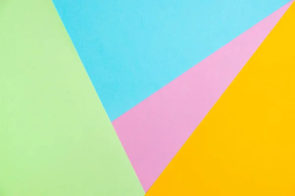 Pastel colored paper flat lay top view, background texture, pink, purple, yellow, beige, green and blue colour.