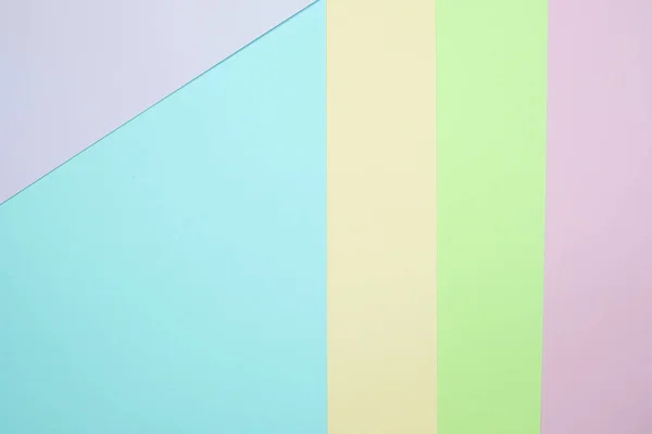Fashionable  pastel colored paper flat lay top view, geometric background texture, pink, purple, yellow, beige, green and blue colour.