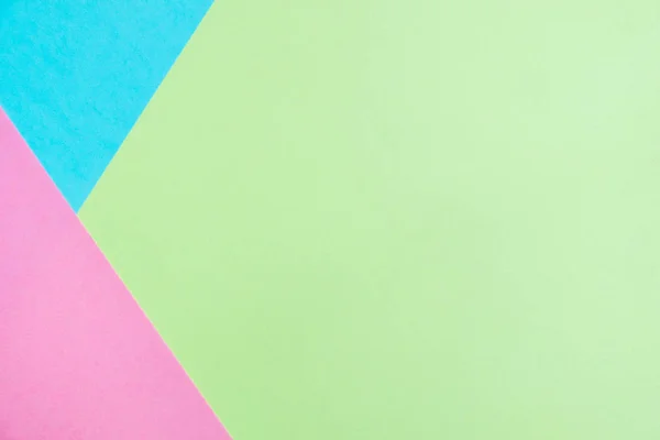 Pastel colored paper flat lay top view, background texture, pink, purple, yellow, beige, green and blue colour.
