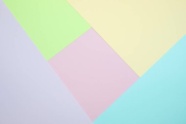 Moda pastel kağıt düz renkli yatıyordu üstten görünüm, geometrik arka plan dokusu, pembe, mor, sarı, bej, yeşil ve mavi renk.