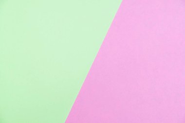 Kağıt düz renkli pastel yatıyordu üstten görünüm, arka plan dokusu, yeşil ve pembe renk.