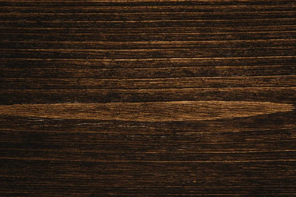 Close up of dark brown wood texture with natural striped pattern for background, wooden surface for add text or design decoration art work
