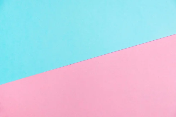 Pastel colored paper flat lay top view, background texture, pink and blue colour.