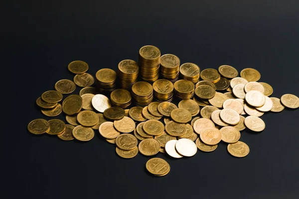 Stock image Savings, increasing columns of coins, piles of coins arranged as a graph in dark room, business banking concept idea