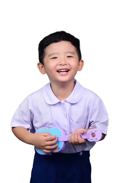 Asiatische Thailändische Kindergartenkind Schuluniform Spielt Spielzeuggitarre Isoliert Auf Weißem Hintergrund — Stockfoto