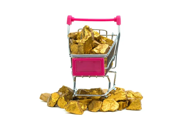 Pile of gold nuggets or gold ore in shopping cart or supermarket trolley on white  background, precious stone or lump of golden stone, financial and business concept idea.