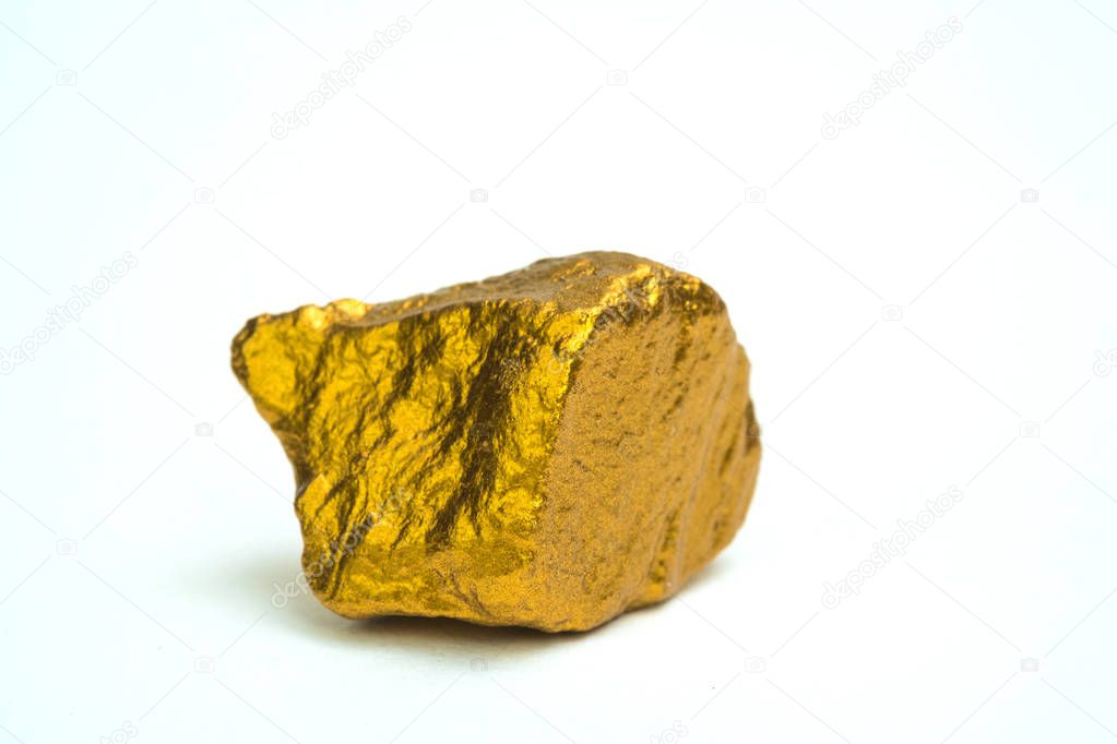 Closeup of gold nugget or gold ore on white background, precious stone or lump of golden stone, financial and business concept idea.