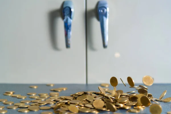 Falling gold coins money on office table with document cabinet background, business money and finance concept idea.