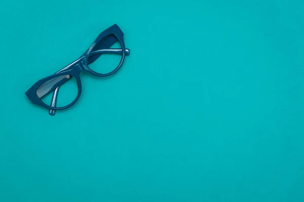 Pohled Shora Plochý Ležel Moderní Modré Oko Brýle Texturu Pozadí — Stock fotografie