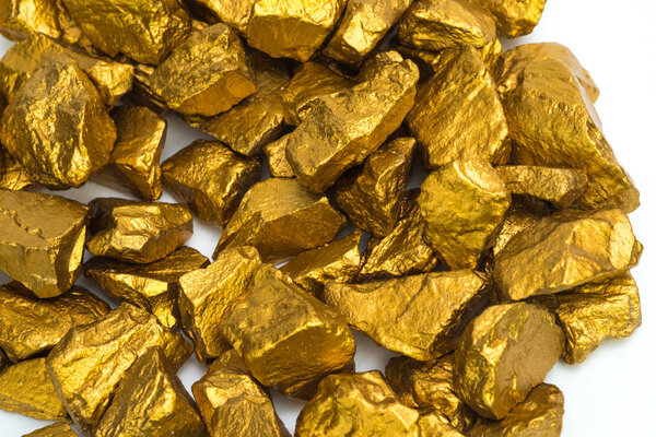 A pile of gold nuggets or gold ore on white background, precious stone or lump of golden stone, financial and business concept idea.