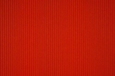 Kırmızı oluklu kağıt dokusu, arka plan için kullanın. kopya alanı için canlı renkli metin veya nesne eklemek.