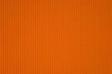 Turuncu oluklu kağıt dokusu, arka plan için kullanın. kopya alanı için canlı renkli metin veya nesne eklemek.