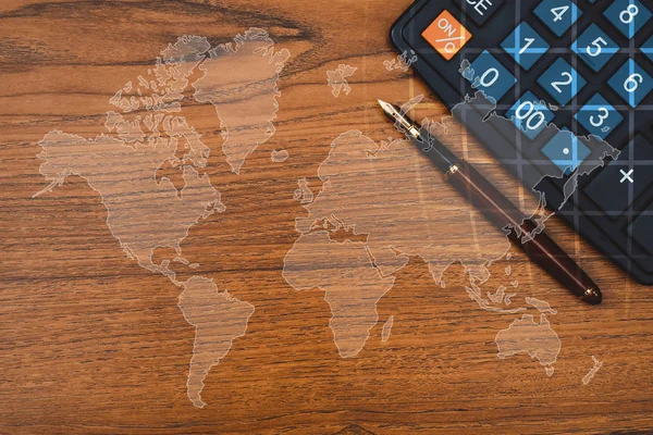 Double exposure of Fountain pen or ink pen with calculator on table with world map, office desk concept idea. element by NASA.