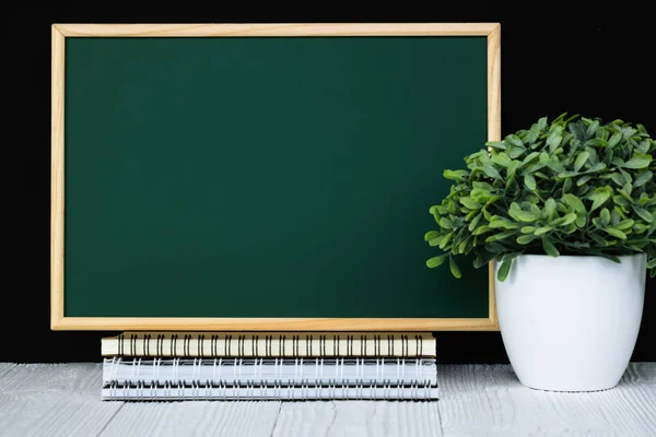 Back to school and education concept, green chalkboard with pile — Stock Photo, Image