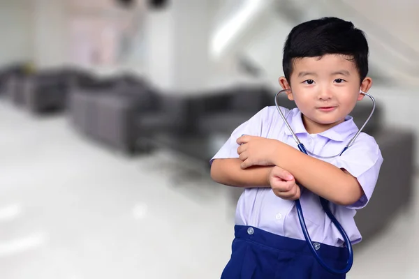 Asian Thai kid with medical stethoscope looking at camera, healt — Stock Photo, Image