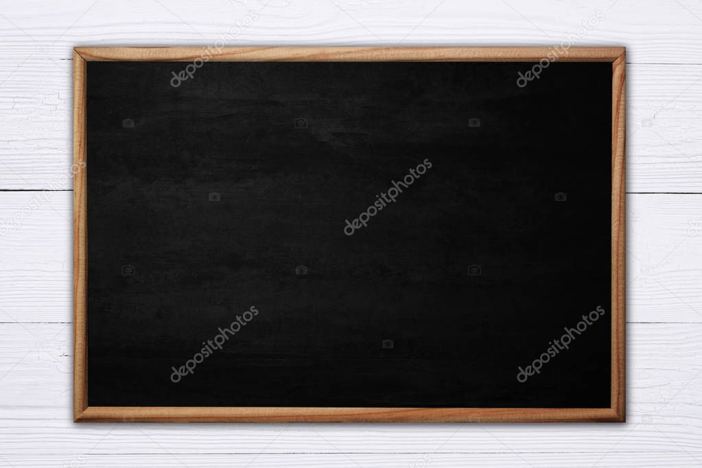 Abstract blackboard or chalkboard with frame on wooden backgroun
