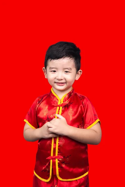 Chinese New Year Concept, Cute Asian boy in red traditional Chin — Stok Foto