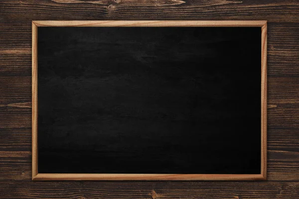 Abstract blackboard or chalkboard with frame on wooden backgroun — Stock Photo, Image