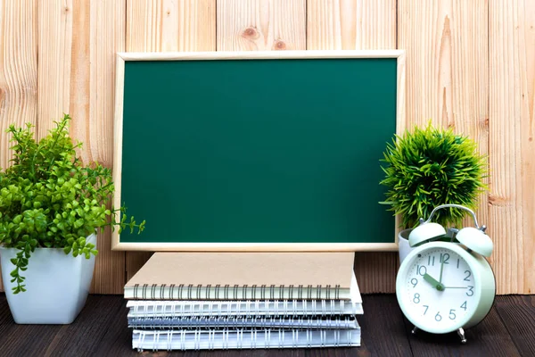 Blank green chalkborad and little tree with vintage alarm clock — Stock Photo, Image