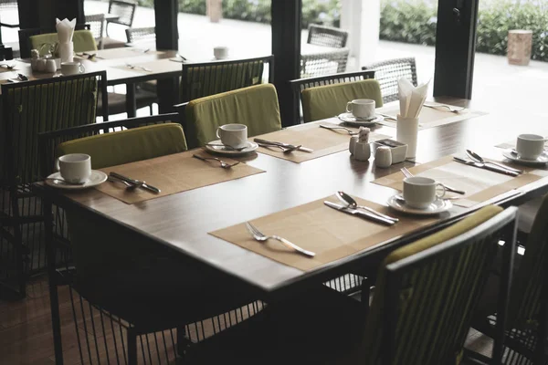 Empty restaurant part of hotel with table and armchair near wind — Stock Photo, Image