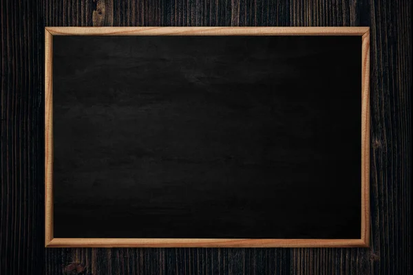 Abstract blackboard or chalkboard with frame on wooden backgroun — Stock Photo, Image