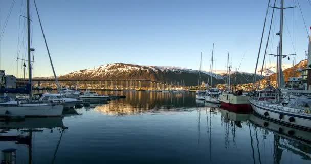 Yachts in the marina on the Lofoten islands, Yachts on the dock in the Tromso time lapse, View of a marina in Tromso at sunset, Tromso is considered the northernmost city in the world with a population above 50,000 — Stock Footage Yachts Marina Lofoten Islands Yachts Dock Tromso Time Lapse View Stock Video