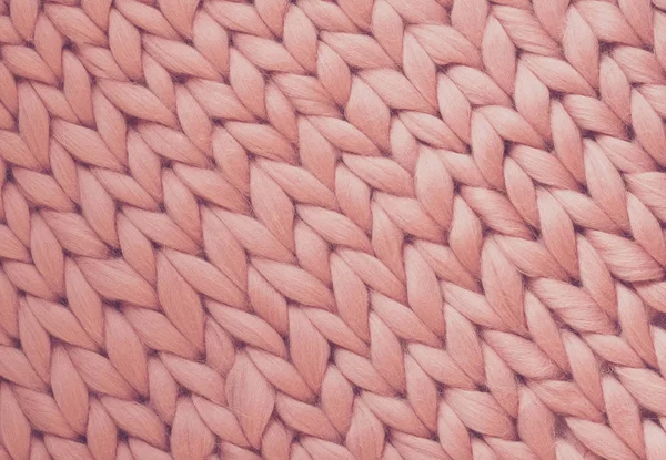 Texture de couverture en tricot rose. Gros tricot. Laine mérinos à carreaux. Vue du dessus — Photo