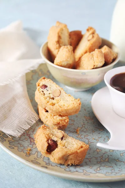 Italian biscuits: almonds biscotti and cup of coffee. Focus selective