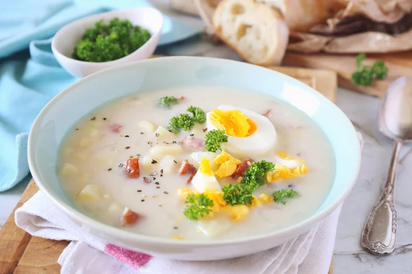 Polish soup Zurek. Sour soup with sausage,  potatoes and eggs