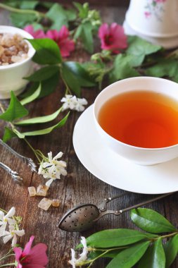 Vintage style: romantic tea drinking with jasmine tea clipart