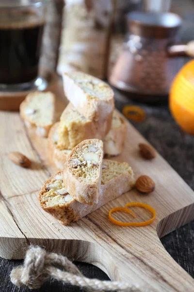 Almond cantuccini with orange peel and cup of coffee — Stock Photo, Image