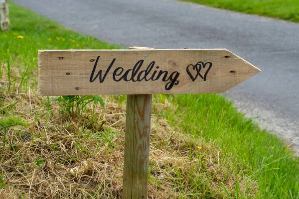 Home made wedding sign giving directions to the venue