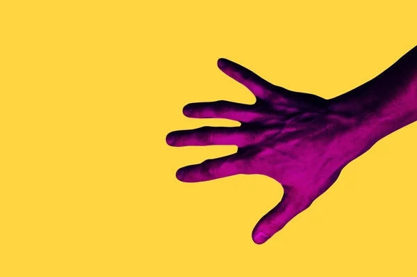 Isolated hand photo on yellow background. Pink hand collage style. Bright pop art template with space for text. Creative minimalistic backdrop. — Stock Photo, Image